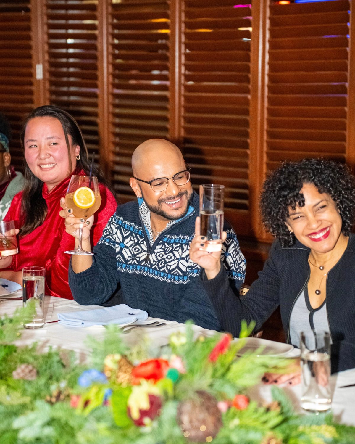 Guests raising a toast at a holiday dinner